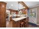 Charming kitchen with brick floors, white countertops, breakfast bar, and dutch door leading to the outside at 7001 S Newport St, Centennial, CO 80112