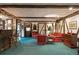 Unique living space with bar area, wooden beams, and plaid furniture at 7001 S Newport St, Centennial, CO 80112