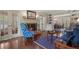 Elegant living room featuring a fireplace, hardwood floors, and stylish furnishings at 7001 S Newport St, Centennial, CO 80112