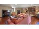 Comfortable living room featuring hardwood floors, a brick fireplace, and cozy furniture at 7001 S Newport St, Centennial, CO 80112