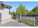 View of the balcony with concrete floor, metal railings, and a view of the street at 22933 E Ontario Dr # 105, Aurora, CO 80016