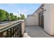 A sunny balcony offers serene outdoor space and beautiful views of the neighborhood street at 22933 E Ontario Dr # 105, Aurora, CO 80016