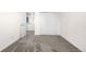 Bedroom with neutral walls and carpet with a closet and doorway to other rooms at 22933 E Ontario Dr # 105, Aurora, CO 80016