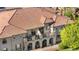 Stunning home with Spanish-style tile roof, multiple balconies and arched entryways at 22933 E Ontario Dr # 105, Aurora, CO 80016
