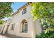 Charming stucco home with architectural details and landscaped front yard, featuring prominent address display at 22933 E Ontario Dr # 105, Aurora, CO 80016