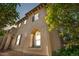 Charming stucco home with architectural details and landscaped front yard, featuring prominent address display at 22933 E Ontario Dr # 105, Aurora, CO 80016