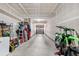 Spacious garage with high ceilings for ample storage or hobbies and a motorcycle for work projects at 22933 E Ontario Dr # 105, Aurora, CO 80016