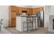 Well-equipped kitchen featuring stainless steel appliances, ample cabinet space, and a breakfast bar at 22933 E Ontario Dr # 105, Aurora, CO 80016