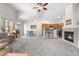 Inviting living space with a fireplace, open kitchen access, and cozy seating area at 22933 E Ontario Dr # 105, Aurora, CO 80016