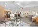 Bright living space with a fireplace, open layout to the kitchen, and large windows with plenty of light at 22933 E Ontario Dr # 105, Aurora, CO 80016