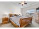 Bedroom showcasing a wooden bed frame, nightstands, and ample natural light at 22933 E Ontario Dr # 105, Aurora, CO 80016
