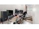 Functional office space with built-in shelving and computer setup at 22933 E Ontario Dr # 105, Aurora, CO 80016