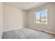 Bedroom with carpet floors and lots of natural light at 2560 Lupton Ln, Lafayette, CO 80026