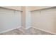 Walk-in closet featuring carpeted floor and closet rods, offering plenty of storage space at 2560 Lupton Ln, Lafayette, CO 80026