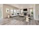 Spacious living room featuring a fireplace, large windows, and ample natural light at 2560 Lupton Ln, Lafayette, CO 80026