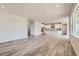Open-concept living space with hardwood floors, recessed lighting, and bright, white kitchen at 2560 Lupton Ln, Lafayette, CO 80026