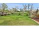 Large, grassy backyard with mature trees at 3970 Pierson St, Wheat Ridge, CO 80033