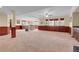 Spacious finished basement with wooden accents, windows, and carpeted flooring at 3970 Pierson St, Wheat Ridge, CO 80033