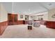 Finished basement with carpeted floors, wood trim, and windows with views at 3970 Pierson St, Wheat Ridge, CO 80033