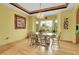 Charming dining room featuring hardwood floors, a bay window, and a decorative chandelier at 3970 Pierson St, Wheat Ridge, CO 80033