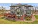 Back of house featuring a private deck and a well-manicured lawn at 3970 Pierson St, Wheat Ridge, CO 80033