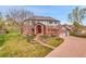 Beautiful home with detailed brickwork, lush landscaping, and a well-kept lawn at 3970 Pierson St, Wheat Ridge, CO 80033