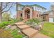Stunning brick home with manicured landscaping and a welcoming front entrance at 3970 Pierson St, Wheat Ridge, CO 80033