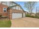 Spacious three-car garage with a wide driveway and well-maintained exterior at 3970 Pierson St, Wheat Ridge, CO 80033