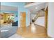Entryway with wood floors, stairs, and an archway leading to the living room at 3970 Pierson St, Wheat Ridge, CO 80033