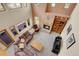 Spacious living room featuring a brick fireplace, bookshelves, and large windows for natural light at 3970 Pierson St, Wheat Ridge, CO 80033