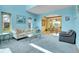 Bright living room with high ceilings, carpeted floors, and an adjacent dining area at 3970 Pierson St, Wheat Ridge, CO 80033