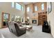 Inviting living room features a fireplace, large windows and comfortable seating at 3970 Pierson St, Wheat Ridge, CO 80033