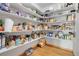 Walk-in pantry with shelves stocked with food and supplies at 3970 Pierson St, Wheat Ridge, CO 80033