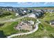Playground and park featuring recreational amenities, surrounded by lush greenery and walking paths in the community at 6456 Kenzie Cir, Castle Pines, CO 80108