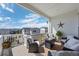 Inviting covered deck offering comfortable seating and scenic neighborhood views, creating a perfect outdoor retreat at 6456 Kenzie Cir, Castle Pines, CO 80108