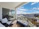 Inviting deck with cozy seating and a warm fire pit, with sliding glass doors and scenic neighborhood views at 6456 Kenzie Cir, Castle Pines, CO 80108