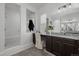 Elegant bathroom with a glass shower, granite countertop vanity, and stylish decor at 6456 Kenzie Cir, Castle Pines, CO 80108