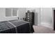 Neutral bedroom featuring a dark-colored iron bed frame and matching dresser at 6456 Kenzie Cir, Castle Pines, CO 80108
