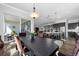 Open-concept dining area with sliding glass doors to the patio, seamlessly connecting indoor and outdoor living at 6456 Kenzie Cir, Castle Pines, CO 80108