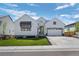 Charming single-Gathering home featuring a well-manicured front lawn, a two-car garage, and a welcoming entrance at 6456 Kenzie Cir, Castle Pines, CO 80108