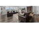 Bright living room with comfortable furniture, fireplace, and large windows at 6456 Kenzie Cir, Castle Pines, CO 80108