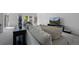 Comfortable living room showcasing a plush sofa, decorative pillows, and modern decor at 6456 Kenzie Cir, Castle Pines, CO 80108