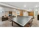 Basement features a ping pong table and a cozy seating area at 2588 S Flower Ct, Lakewood, CO 80227