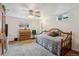 This bedroom features a daybed, closet, and natural light from two windows at 2588 S Flower Ct, Lakewood, CO 80227