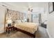 Charming bedroom features a ceiling fan, bright window and neutral carpet at 2588 S Flower Ct, Lakewood, CO 80227