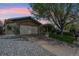 Charming home with attached garage, well-maintained lawn, and mature shade tree at 2588 S Flower Ct, Lakewood, CO 80227