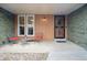 Charming front porch with seating area and an inviting entryway, perfect for relaxation at 2588 S Flower Ct, Lakewood, CO 80227
