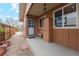 Inviting front porch with stone walkway, outdoor storage, and neutral tones at 2588 S Flower Ct, Lakewood, CO 80227