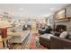 Bright and spacious living room featuring a fireplace and an open floor plan at 2588 S Flower Ct, Lakewood, CO 80227