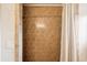This shower features neutral tile and a shower curtain at 2588 S Flower Ct, Lakewood, CO 80227